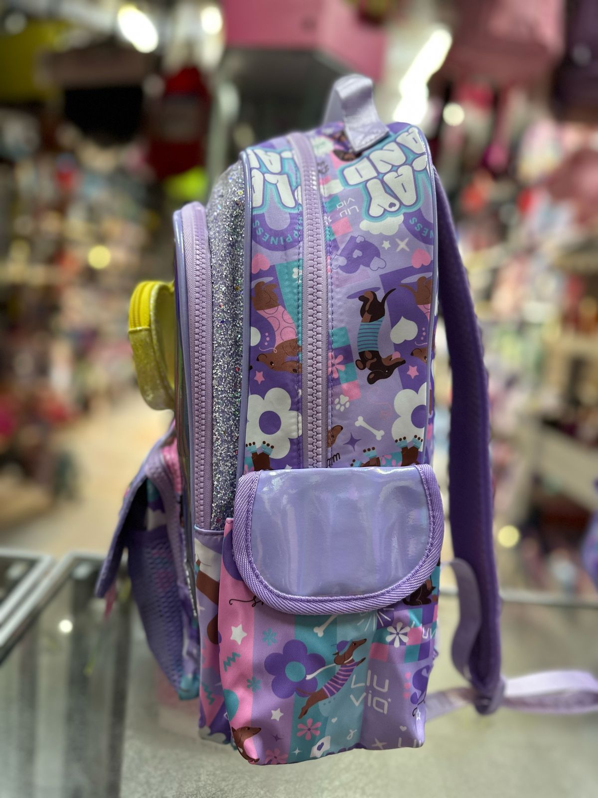 Mochila primaria stickers tornasol Lila lluvia