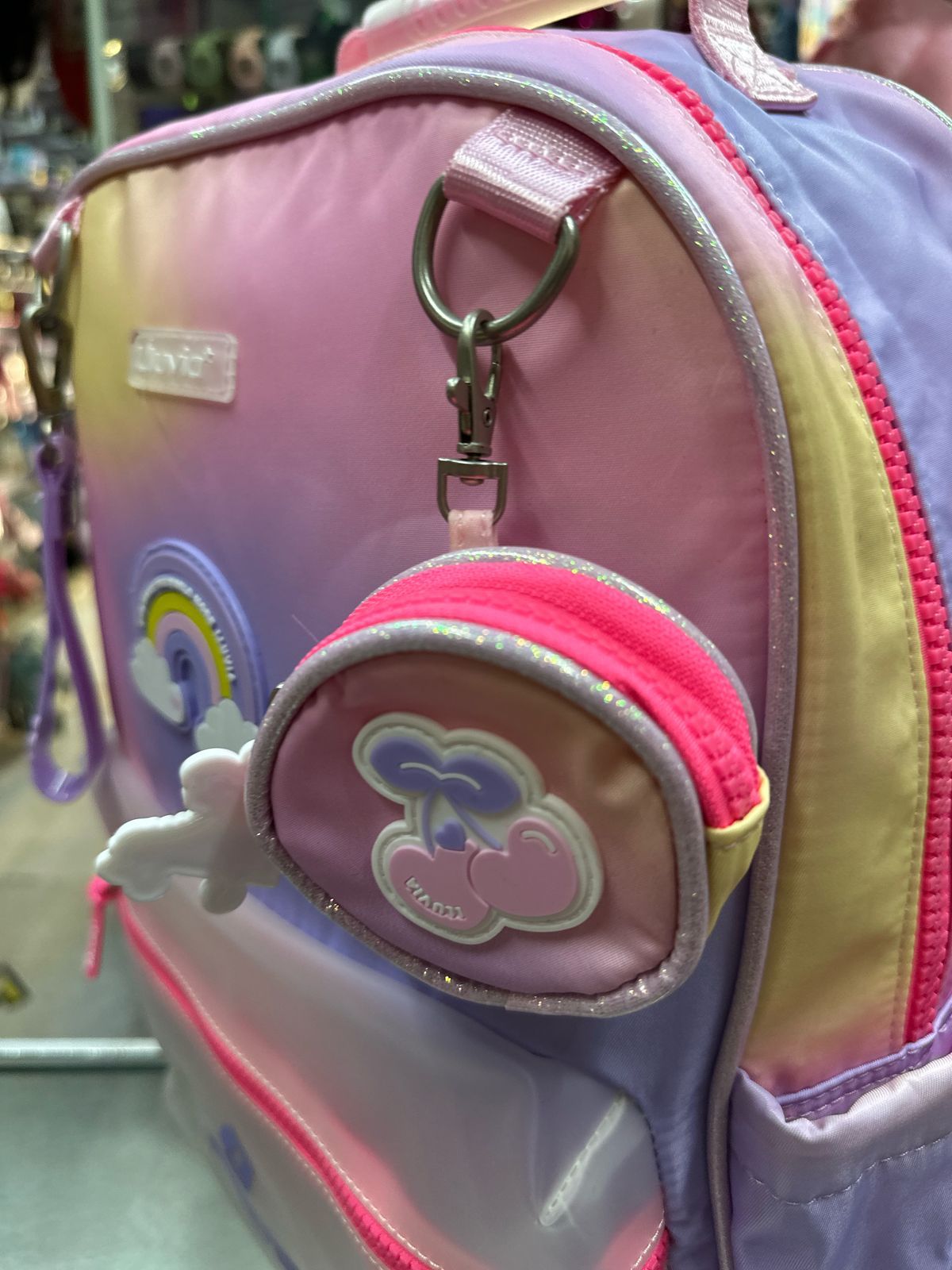 Mochila primaria arcoiris tornasol lluvia