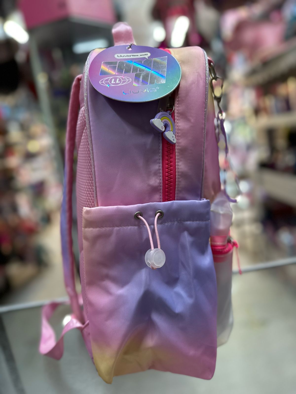Mochila primaria arcoiris tornasol lluvia