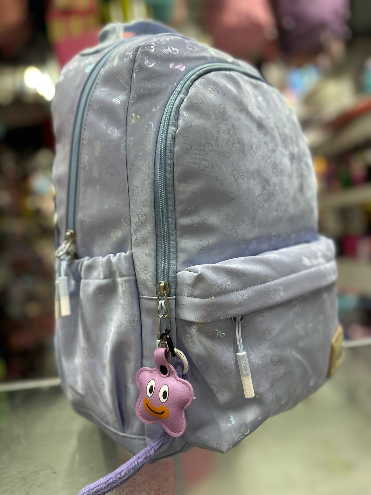 Mochila juvenil corazones tornasol azul lluvia