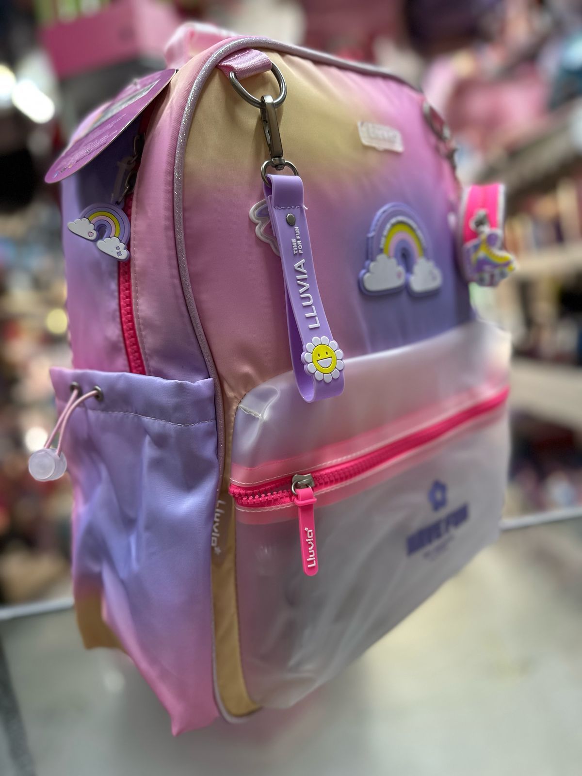 Mochila primaria arcoiris tornasol lluvia